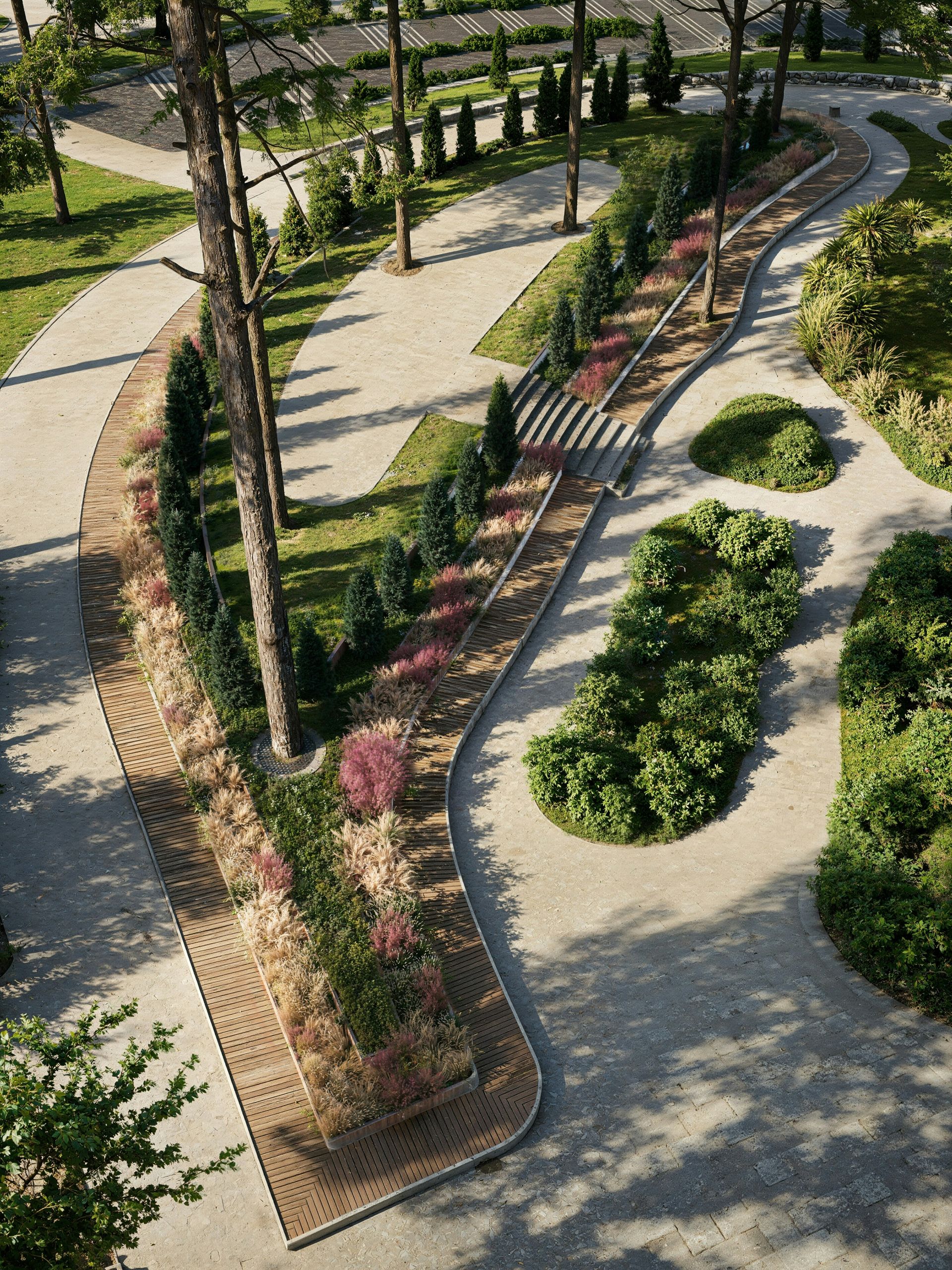 Modern park with winding paths, tall trees, and colorful plants